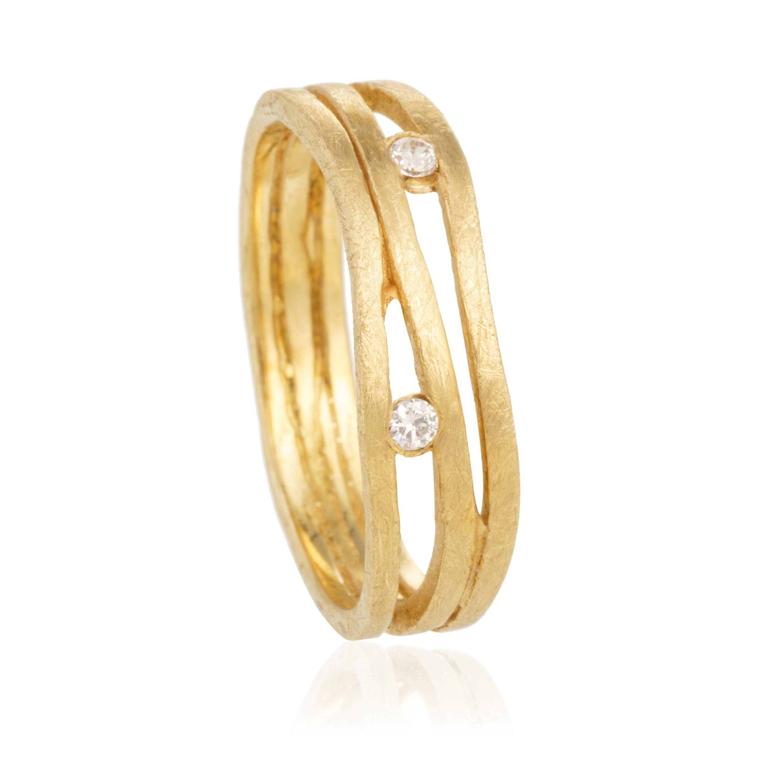 Anillo tres lineas dos brillantes